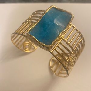 Gold wire cuff bracelet with an accent stone